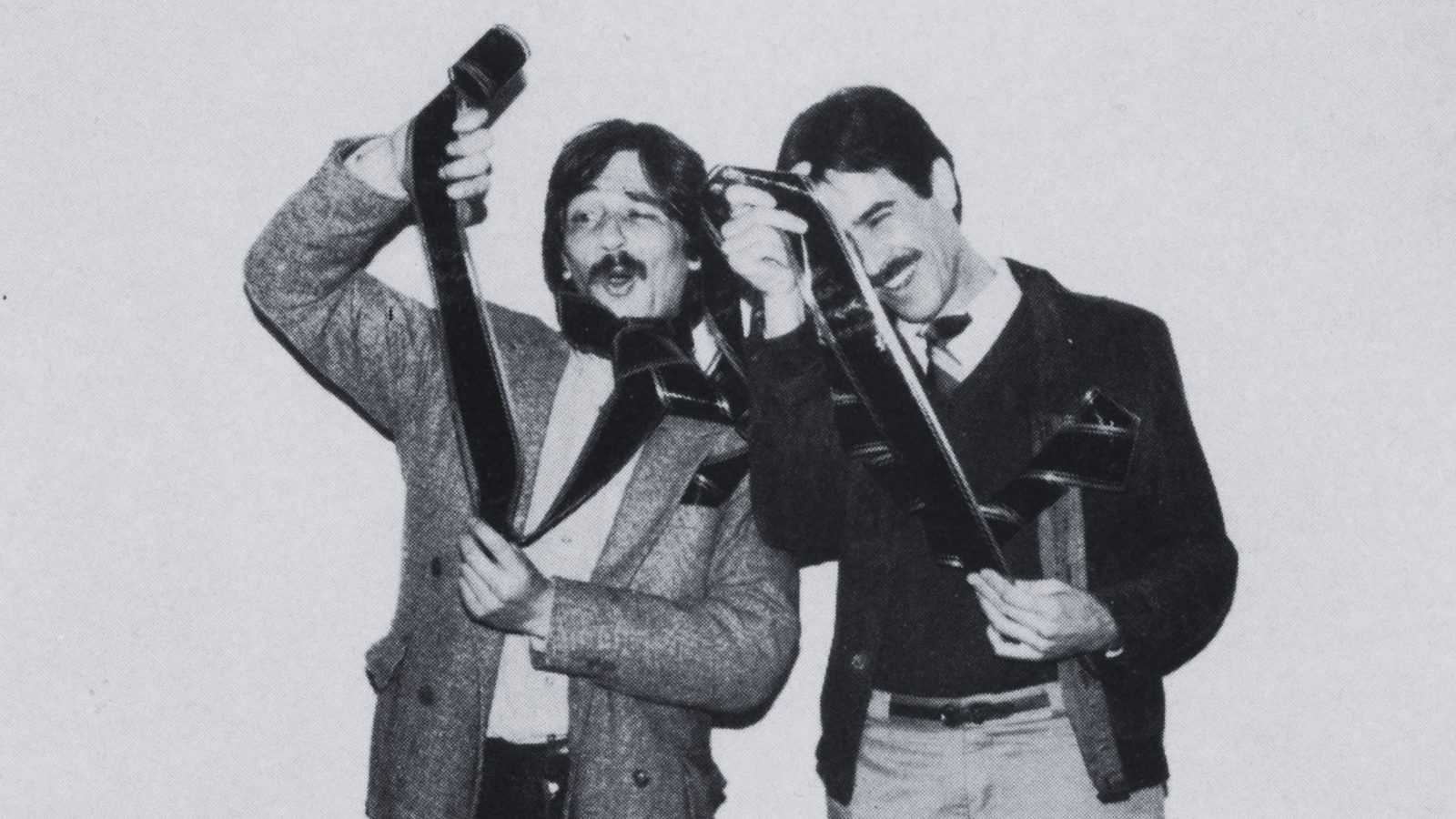 Festival Founders, Darryl Macdonald and Dan Ireland, inspect film for the 7th Seattle International Film Festival