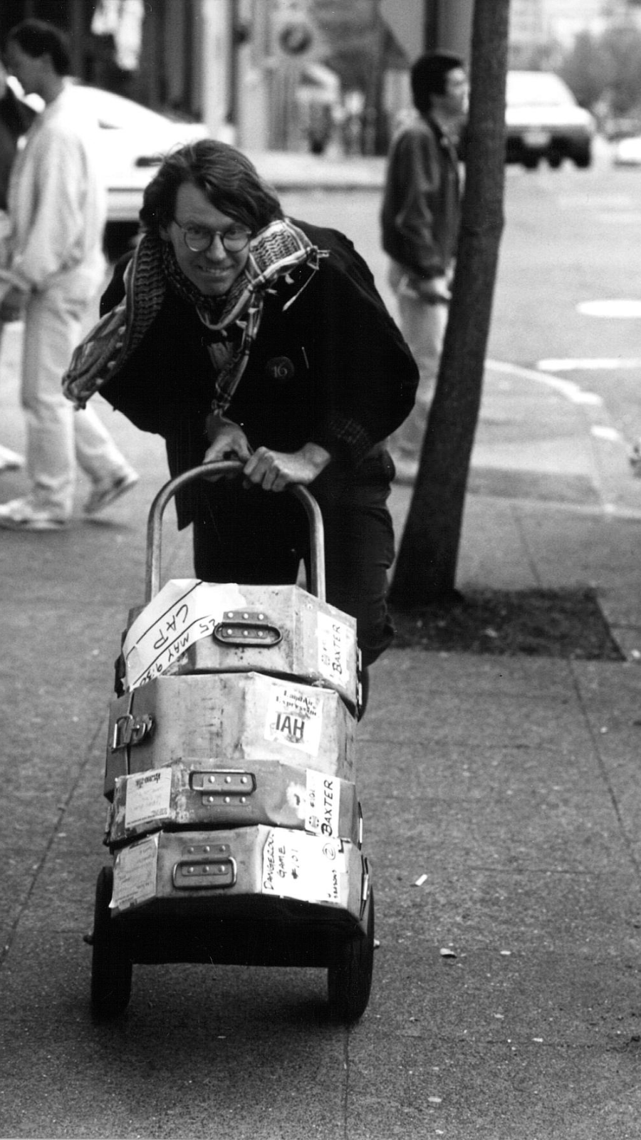 SIFF staff, Nils Von Veh, responsible for media relations and marketing, carts film cans down the streets of Seattle
