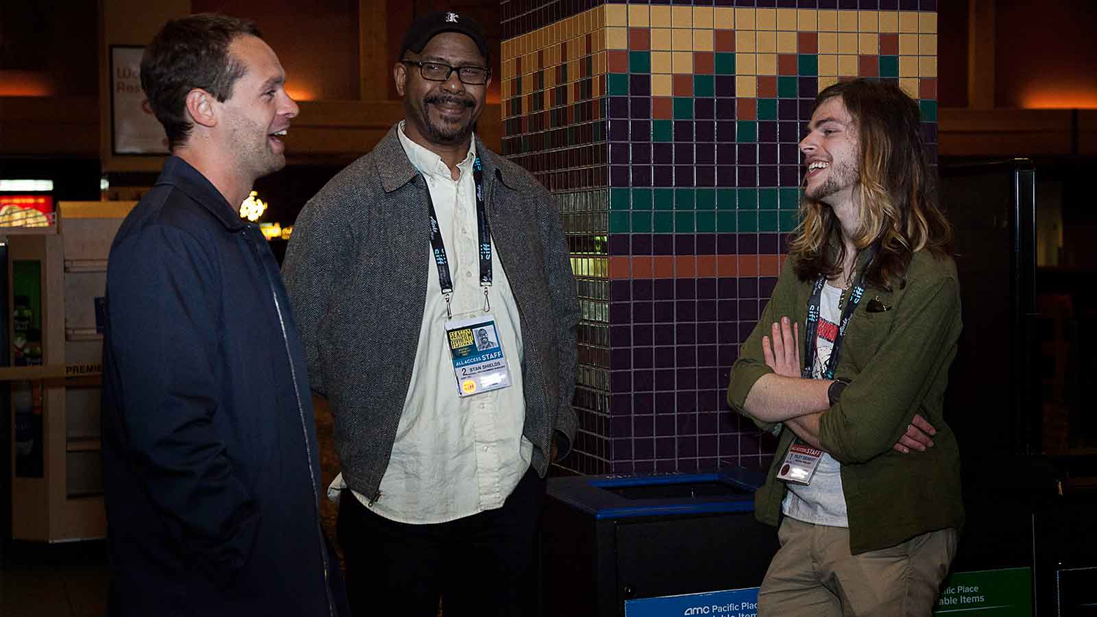 Director Kevan Funk talks with Stan Shields and SIFF staff member
